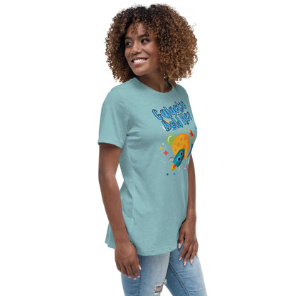 Woman wearing Celestial Souls Women’s Relaxed T-Shirt with rocket graphic, styled for a casual look.