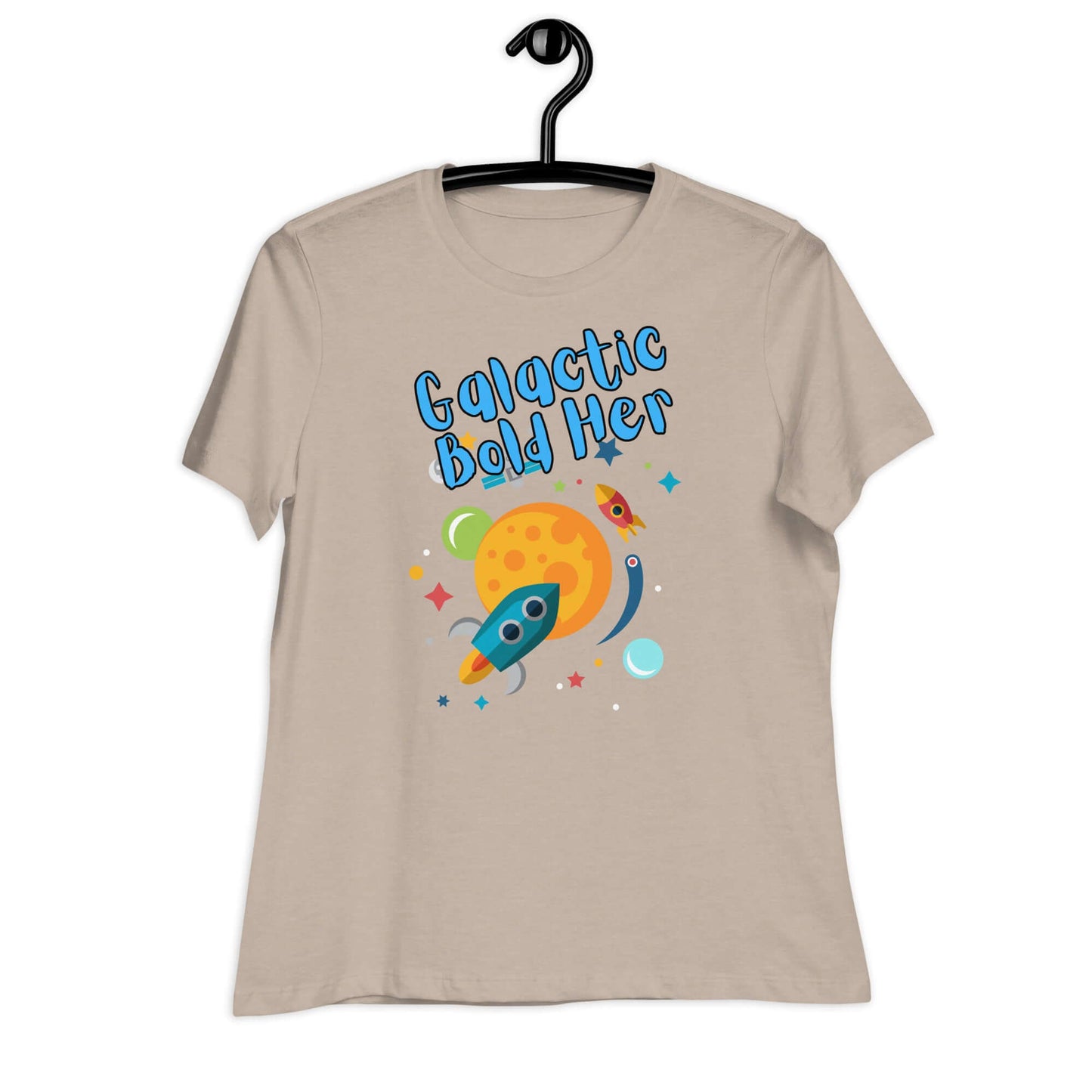 Galactic Bold Her graphic t-shirt for women featuring a colorful rocket and planet design on a beige background.