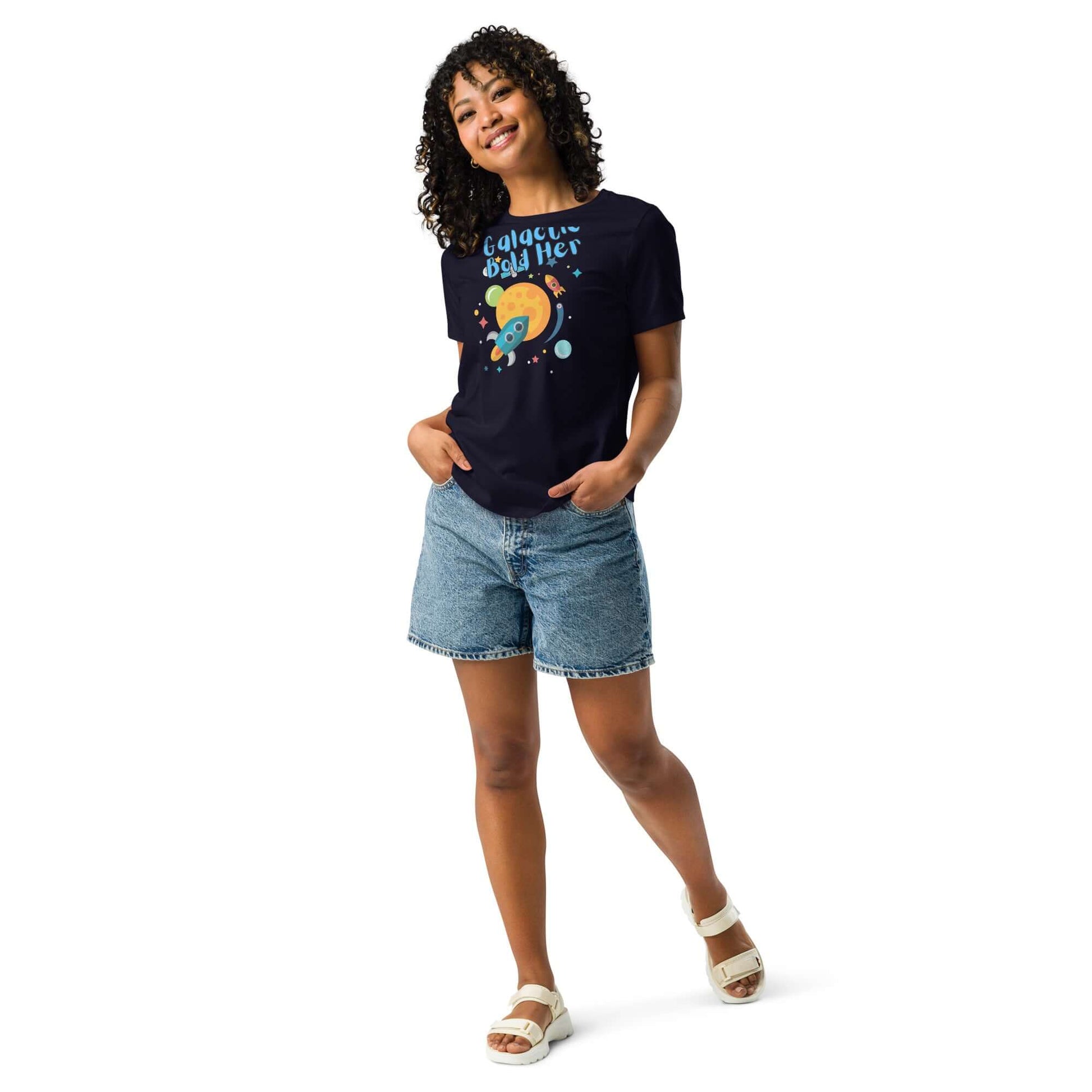Celestial Souls Women’s Relaxed T-Shirt displayed by a model in denim shorts and sandals, showcasing a fun graphic design.